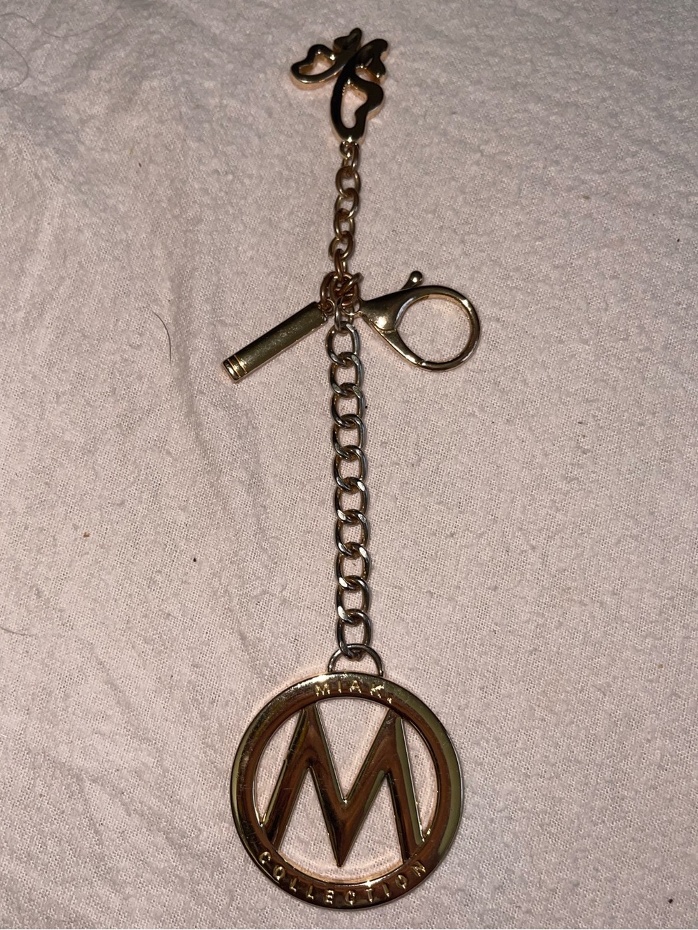 gold-tone logo charm keychain bag accessory